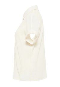 Krátký rukáv blůza v off-white látce se strukturovaným límcem. Má rovný střih a jemnou texturu, což zajišťuje minimalistický design.