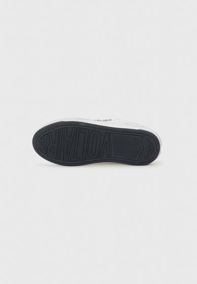 White sneaker with a textured black rubber sole. Features a printed logo on the side and a smooth, clean upper design.