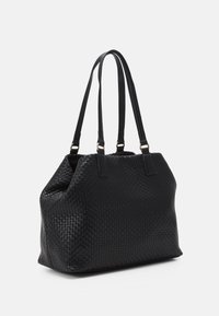 Black woven tote bag with two long straps, a structured shape, and subtle texture. Features gold-tone hardware accents.