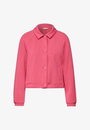 Veste rose, cropped, avec un col rond, une fermeture à boutons et des poches latérales. Fabriquée en tissu doux, avec des poignets et un ourlet côtelés.