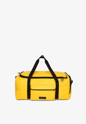 Gelbe Sporttasche aus strapazierfähigem Material mit schwarzen Trägern, Reißverschlusstasche und Akzenten; runde Form mit einem flachen Boden für Stabilität.