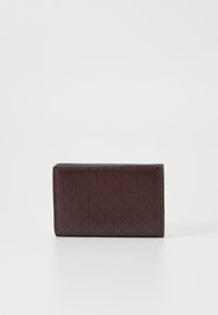 Maroon leather wallet featuring a geometric embossed pattern, rectangular shape, and sleek edges, suitable for cards and cash.