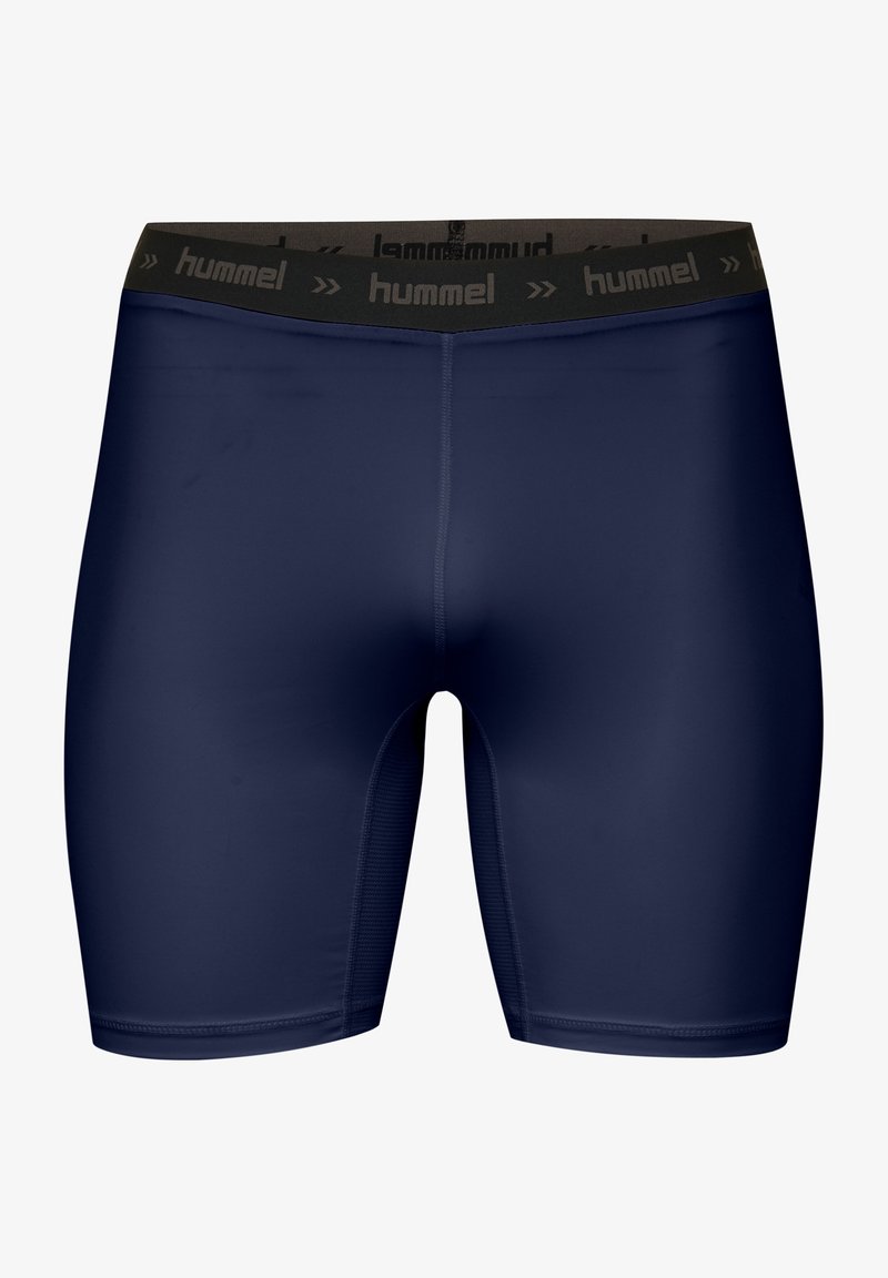 Marinblå sportshorts gjorda av stretchy material, med en svart midja med "hummel"-logotyp och slät textur.