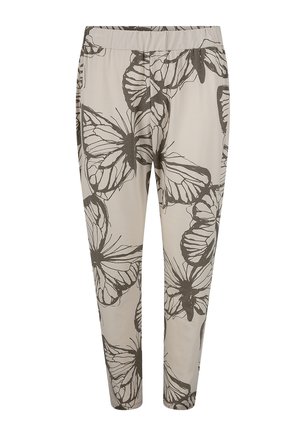 Light beige pants with a butterfly print in dark brown. Features an elastic waistband and tapered legs. Soft modal fabric texture.