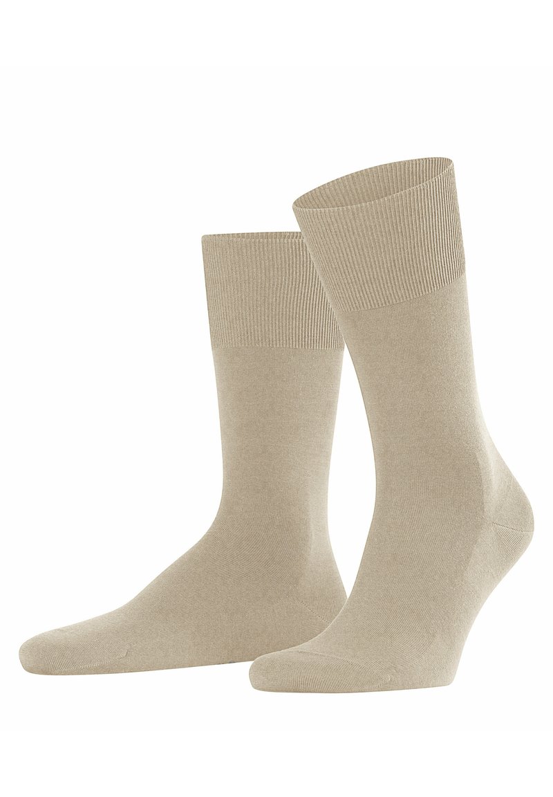 Calzini in cotone beige con polsini a coste, texture liscia, lunghezza a mezza coscia e rinforzo su tallone e punta per maggiore durata.