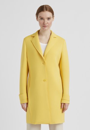 Yellow coat with a tailored design, featuring a notched collar, two-button front, and long sleeves with wide cuffs. Smooth texture.