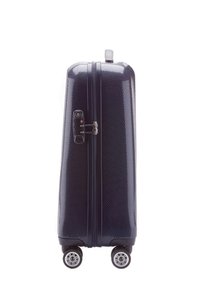 Valise rigide de couleur bleu foncé, dotée d'une finition texturée, de deux zippers et de quatre roulettes pivotantes pour une mobilité facile.