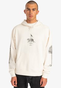 Cream-colored hoodie featuring a graphic of a tiger and bird, with detailed illustrations on sleeves. Soft fabric, drawstring hood, front pocket.