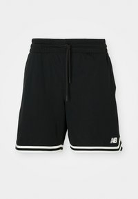Shorts de sport noirs en tissu en maille avec taille élastiquée à cordon, présentant des accents blancs sur l'ourlet et un logo visible sur le côté.