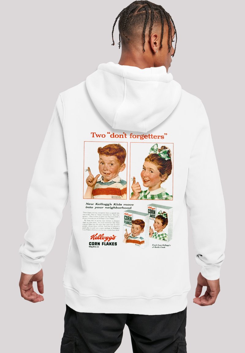 White hoodie featuring a vintage Kellogg's Corn Flakes advertisement on the back, with colorful graphics of two children and text.