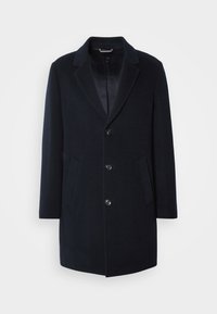 Marineblauer Wollmantel mit Reverskragen, fünf Knöpfen und seitlichen Taschen. Glatte Textur mit maßgeschneiderter Silhouette.