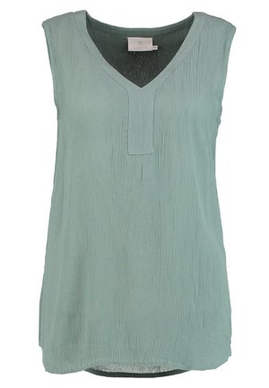 Haut sans manches vert clair avec un décolleté en V, doté d'un tissu texturé et d'une coupe droite. L'ourlet est légèrement arrondi en bas.
