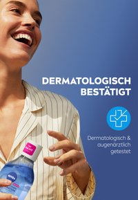 Nivea bottle with pink cap, blue liquid, held by a person in a striped, white blouse. Background is a solid blue. Text indicates dermatological testing.