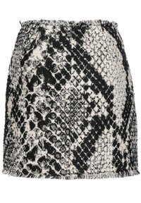 Svart och vit tweedkjol med ormskinnsmönster, fransad fåll och mjuk struktur med midjeresår.
