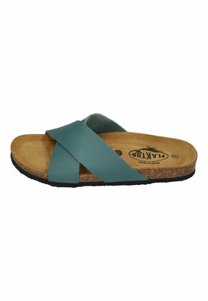 Teal leather slide sandal with cross straps, cork footbed, and textured rubber outsole. Simple design, with beige interior and brand logo.
