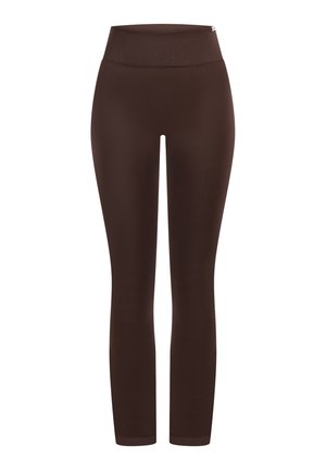 Brązowe legginsy z wysokim stanem, gładkim wzornictwem i gładką fakturą. Przylegające do ciała, długości całkowitej, wykonane z elastycznego materiału.