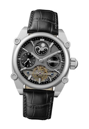 Montre automatique pour hommes avec un boîtier en acier inoxydable argenté, un cadran noir, un bracelet en cuir et des détails de mouvement complexes visibles.