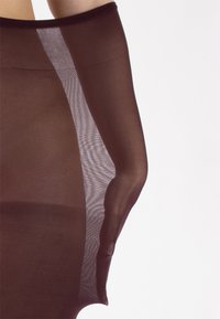 Collant trasparenti marroni con una texture liscia, caratterizzati da un pannello a rete leggero sul lato e una vita ampia ed elasticizzata.