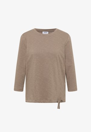 Beige langmouwtop met een ronde halslijn, textuurstof en verstelbare strikdetail aan de zijkant voor een goede pasvorm. Eenvoudig design met een casual uitstraling.