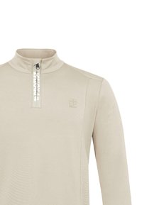 Jersey beige de manga larga con cremallera hasta un cuarto y texto blanco "PROTEST" en la tapa de la cremallera, con un pequeño logo en el pecho.