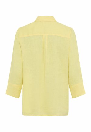 Lysegul linnedragt med lange ærmer, rygudskæring, central læg og klassisk krave, vist bagfra.