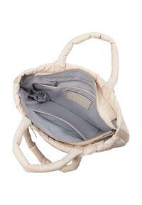 Sac fourre-tout rembourré en crème avec deux poignées. L'intérieur présente une doublure grise, une poche zippée et plusieurs compartiments pour l'organisation.