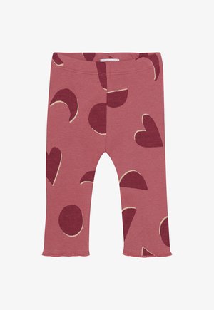 Leggings pour tout-petits rose côtelés avec des cœurs rouges foncés, des cercles et des formes en croissant, dotés d'un ourlet volanté au bas de chaque jambe.