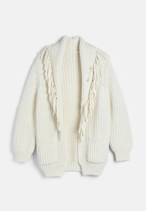Cardigan en grosse maille couleur crème avec des franges le long des bords avant et deux poches avant.