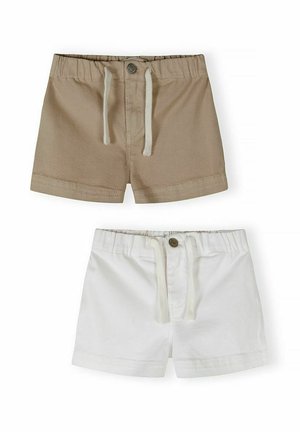 Dwie pary szortów dziecięcych, jedna beżowa, druga biała, obie z elastycznymi pasami, zapięciem na guziki oraz sznureczkami do wiązania.