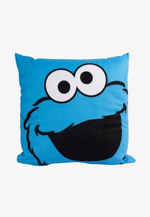 Cuscino blu con il volto di un personaggio dei cartoni animati, dotato di grandi occhi bianchi e una bocca nera, realizzato in tessuto morbido con una texture liscia.