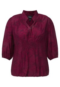 Bordeauxfarbige Bluse mit schwarzem Leopardenmuster, mit gerafftem Taillenbereich und kurzen Puffärmeln. Mit V-Ausschnitt und aus leichtem, strukturiertem Stoff.