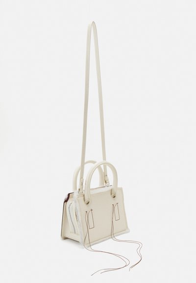 White leather handbag with two short handles, elongated shoulder strap, and visible stitching. It features various compartments and textured accents.