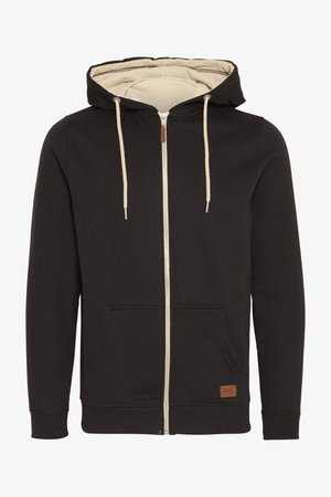 Mustat vetoketjuhupparit, joissa on vaaleanbeige sisus. Varustettu kiristettävällä hupulla, etutaskuilla ja ruskealla nahkalogolla. Silkkinen pinta.