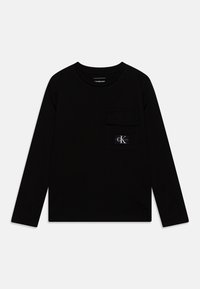 Black long-sleeve T-shirt made of cotton, featuring a front pocket with a logo patch. Crew neck and relaxed fit with smooth texture.
