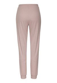 Light pink, fitted jogger pants made from soft fabric, featuring an elastic waistband and ribbed cuffs at the ankles.