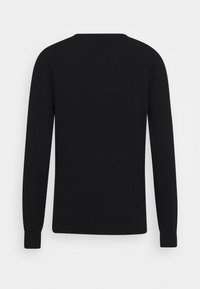 Zwarte lange mouwen trui van glad gebreide stof, met een ronde hals en aansluitende manchetten, met een strakke, minimalistische uitstraling.