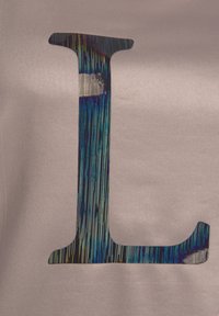 Metallic letter "L" with vertical rainbow stripes on a textured light gray fabric background. Smooth surface with a matte finish.
