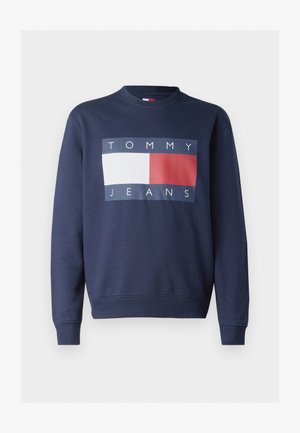 Marineblå hettegenser med round neckline, som har en stor rektangulær logo med teksten "TOMMY" og "JEANS" i hvit, blå og rød.