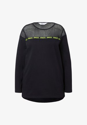 Black long-sleeve top featuring a mesh upper section and neon text reading "ANGEL." The fabric has a smooth texture with a rounded hem.