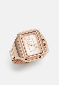 Montre carrée en or rose avec un cadran minimaliste, comportant des index en chiffres romains et un bracelet texturé. Logo de la marque visible sur le cadran.
