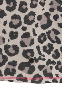 Leopard print fabric featuring black and gray spots on a beige background, with a pink stitched hem and a circular metal logo accent.