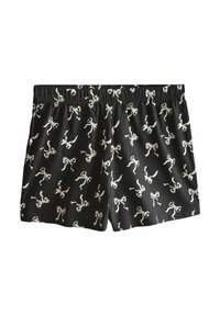 Black boxer shorts featuring a repetitive white bow pattern, with an elastic waistband and soft fabric texture.