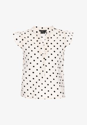 Täppidega pluus, millel on mugav lõige, lühikesed ruffles varrukad, mustad täpid kreemival taustal, V-kaeluse ja kergest kangast.