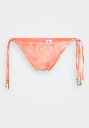 Bikini bottom in coral with a floral pattern, featuring adjustable ties and gold accents. Made of sleek, smooth fabric with additional textures.
