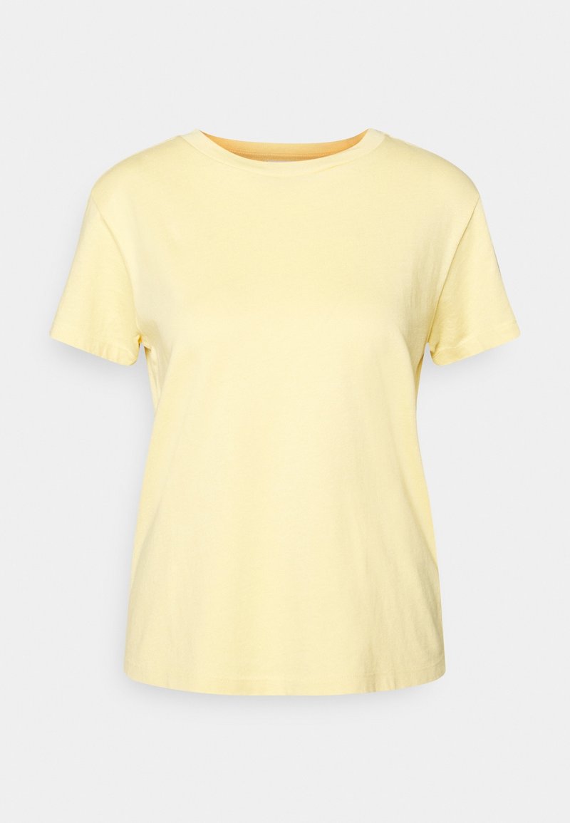 Short-sleeve, crew-neck t-shirt in soft yellow cotton. Smooth texture, a relaxed fit, and even stitching along the hems and neckline.