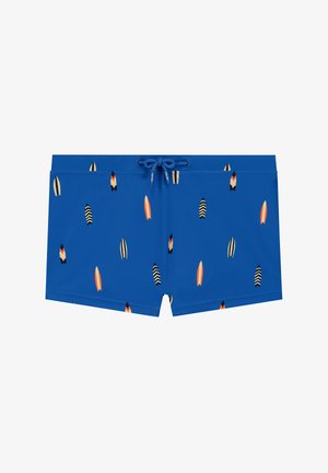 Sinised ujumispüksid kerge kangaga, millel on lõhik vöös ja värviliste surfilaudade muster.