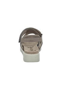 Open-toed sandal with gray leather straps, padded footbed, and white rubber sole featuring vertical grooves for traction.