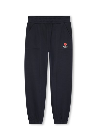 Donkerblauwe sweatpants gemaakt van zachte stof, met een elastische tailleband, zijzakken en een rood bloemlogo aan de voorkant.