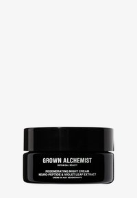 Czarny słoiczek regenerującego kremu na noc Grown Alchemist z białym napisem. Zawiera neuro-peptydy i ekstrakt z liści fiołka. Gładka powierzchnia.