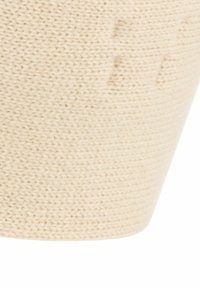 Panier de rangement tressé en beige, avec un design en tricot texturé et une forme conique, idéal pour l'organisation et la décoration.